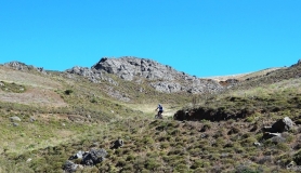 mountain biker on the way to the top