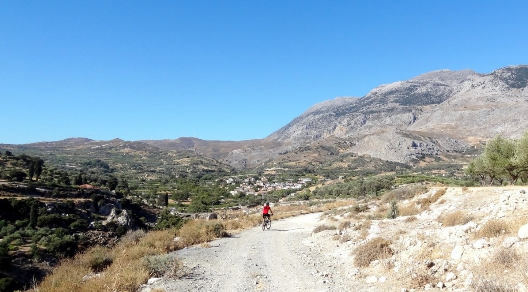 ano asites village Crete and cyclist summer view