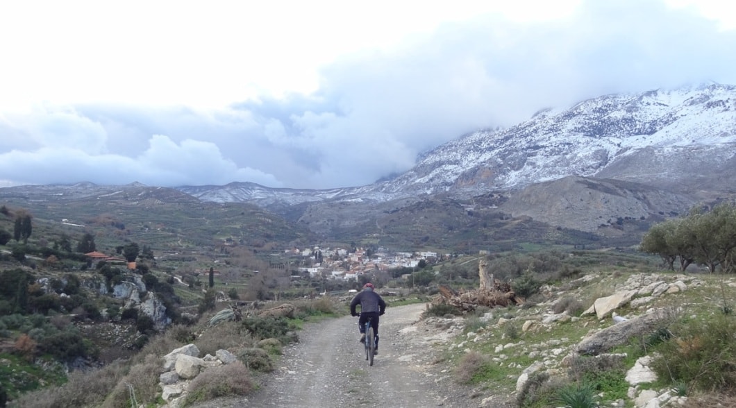 ano asites village Crete and cyclist winter view