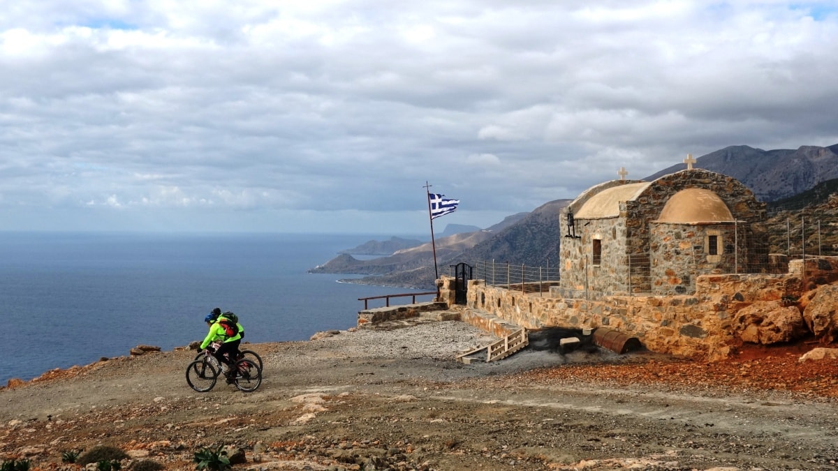 Church and greek flag downhill to koudoumas monastery-min